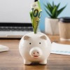 front-view-office-items-with-piggy-bank.jpg