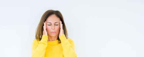 Kaj povzroča tenzijski glavobol in kako si pomagati?