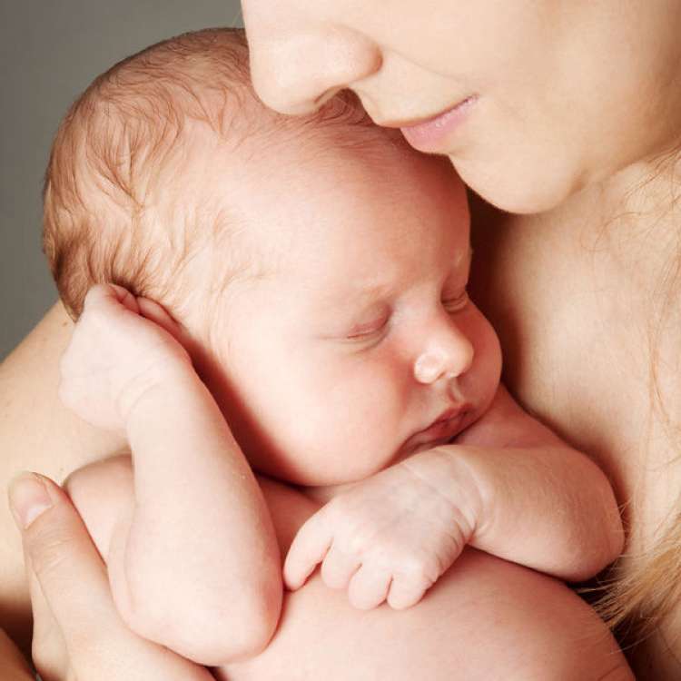 mother-snuggling-infant_600x600_shutterstock_93691387