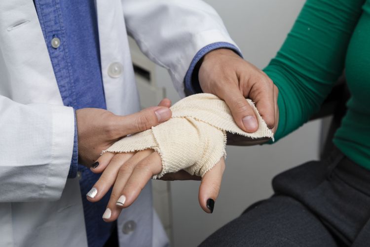 close-up-doctor-bandaging-arm.jpg
