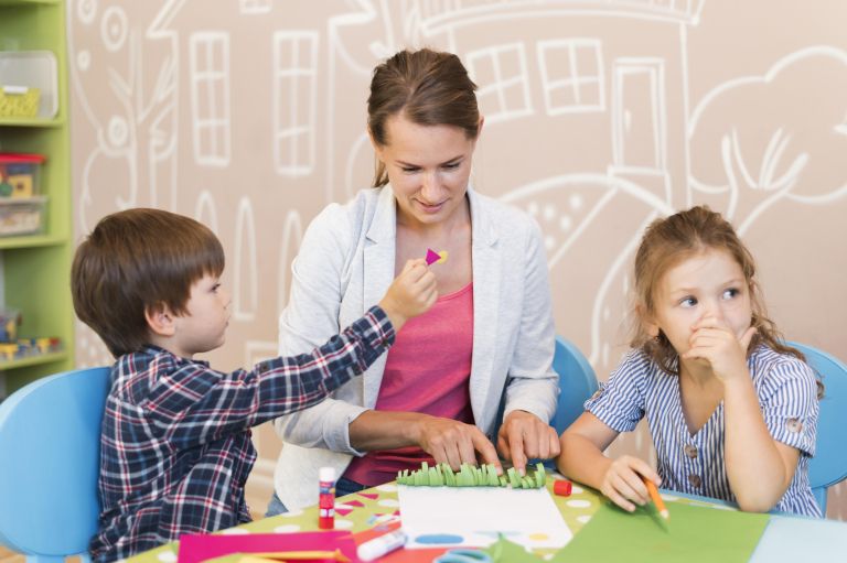 medium-shot-teacher-helping-kids.jpg