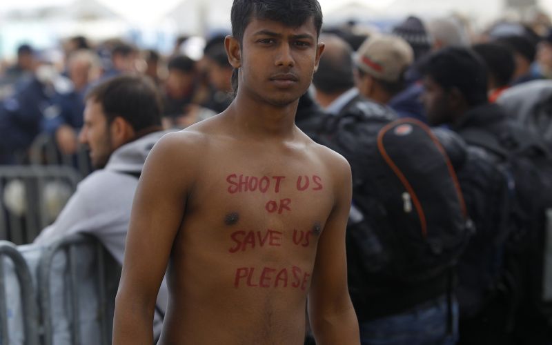 Migrant looks on, as he waits to cross the border from Greece to Gevgelija