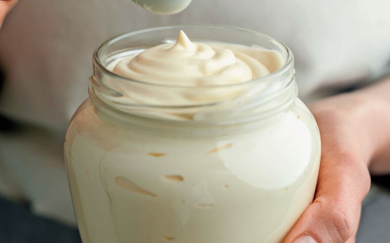 Woman,Holds,In,Her,Hands,A,Glass,Jar,Of,Mayonnaise