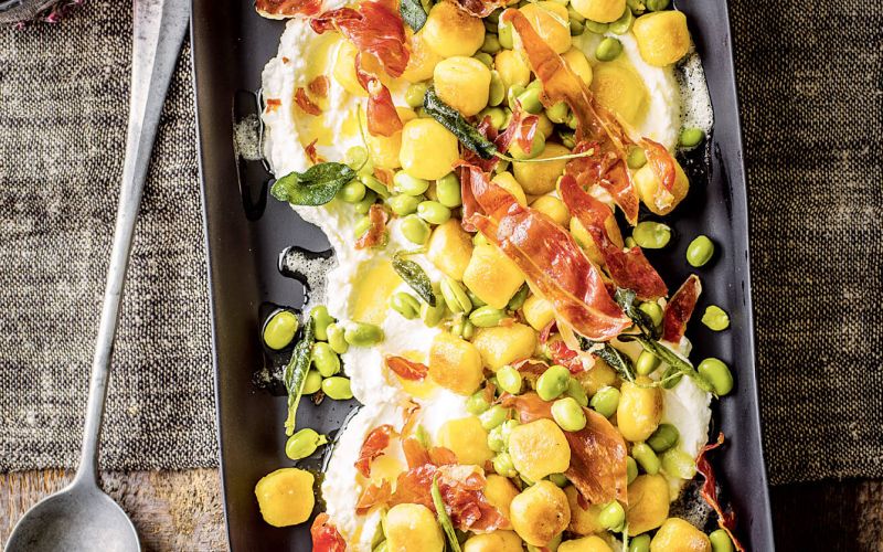 Fried gnocchi with broad beans, parma ham, ricotta and sage