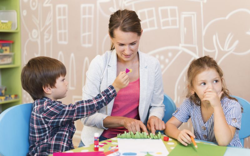 medium-shot-teacher-helping-kids.jpg