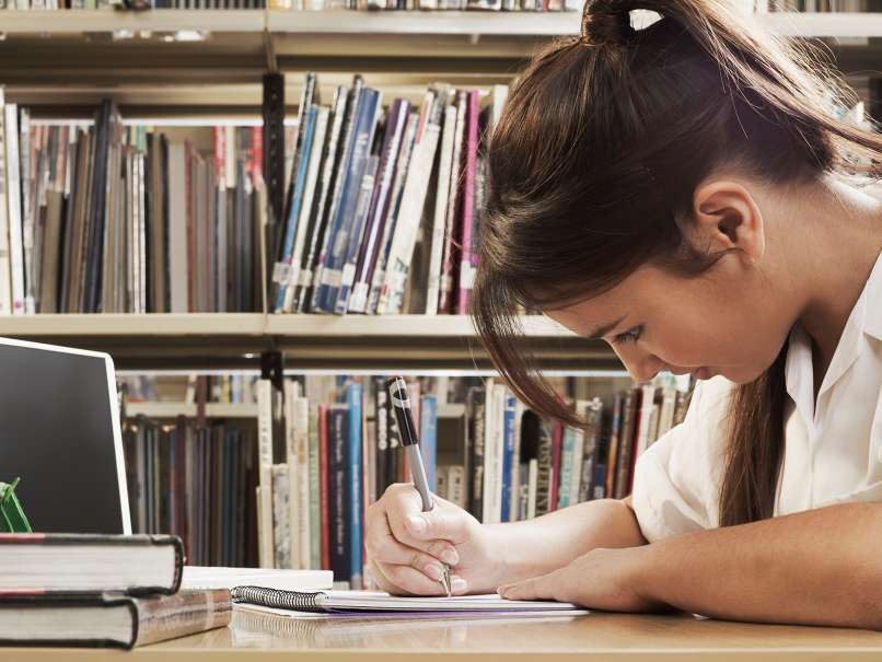 girl learning in library