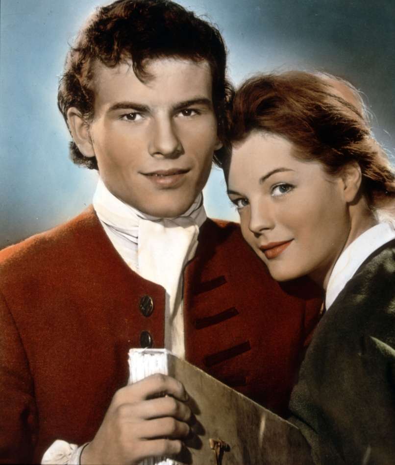 Z Romy Schneider je zaigral v dveh filmih, Monpti (1957) in Dekle in legenda (1957)