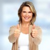 happy-senior-woman-smiling-over-blue-background-79496022.jpg