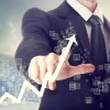 Businessman Touching a Chart Indicating Growth