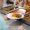 Volunteers serving food for poor people : Food sharing concept