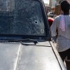haiti oborožene tolpe razbito steklo avto šiša