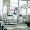 temeljni-kamen-lek-lendava, sandoz, laboratorij-kontrolo-kakovosti, simbolična, farmacija