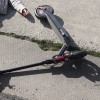 full-shot-man-electric-scooter-laying-ground.jpg