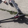 full-shot-man-electric-scooter-laying-ground.jpg