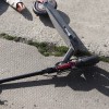 full-shot-man-electric-scooter-laying-ground.jpg