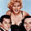 Trije obrazi legende: Marilyn Monroe, Tony Curtis in Jack Lemmon – kemija na plakatu popolna, v resn