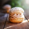 delicious-sandwich-cakes-with-custard-creme-powdered-sugar-wooden-table-closeup-photo-shoot.jpg