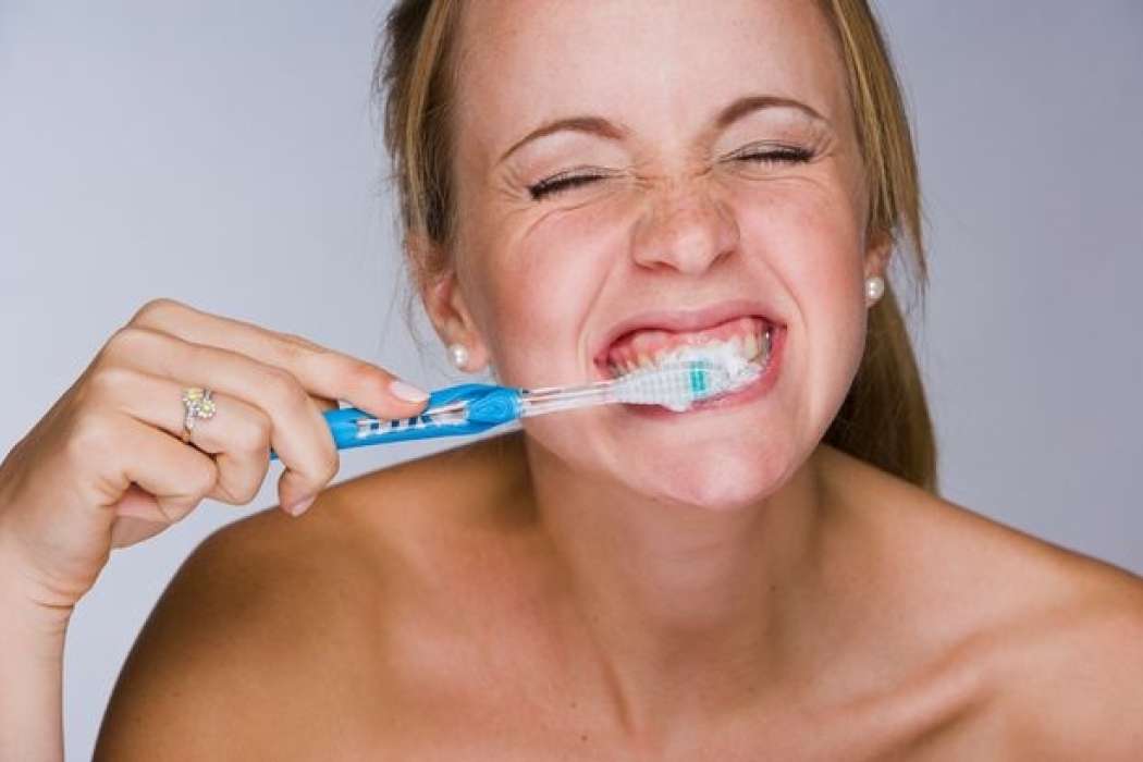 Woman brushing her teeth