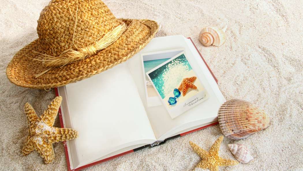 straw_hat_open_book_seashells_starfish_sand_background-1920x1080