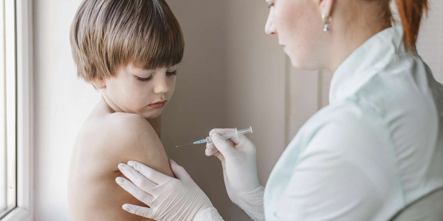 doctor-with-child-getting-vaccine