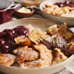selective-focus-closeup-shot-delicious-fluffy-pancakes-with-cherry-powdered-sugar