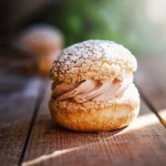 delicious-sandwich-cakes-with-custard-creme-powdered-sugar-wooden-table-closeup-photo-shoot