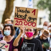 berlin, protest, migranti