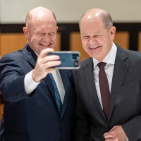 chris coons, olaf scholz