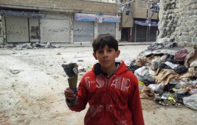 V oblegani Homs prišla humanitarna pomoč