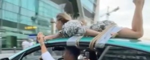 FOTO in VIDEO: Punco prilepil na streho svojega prestižnega avtomobila