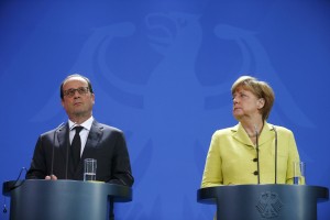 Merklova in Holland s Putinom o nasilju na vzhodu Ukrajine