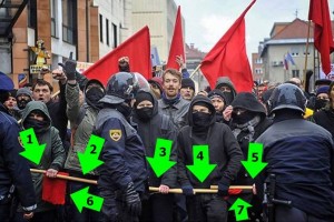 Zamaskirani skrajni levičarji na shodu oboroženi s palicami za pretepanje (FOTO)