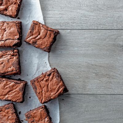 Chocolate,Brownie,On,Paper,On,Dark,Grey,Base,Top,View