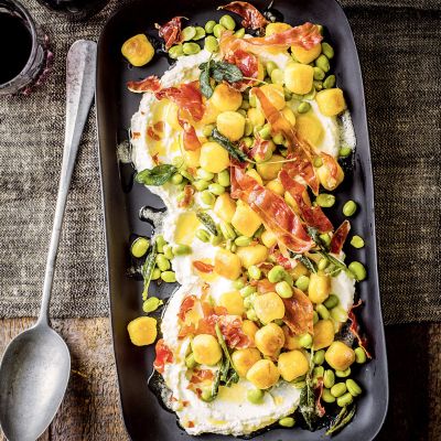 Fried gnocchi with broad beans, parma ham, ricotta and sage