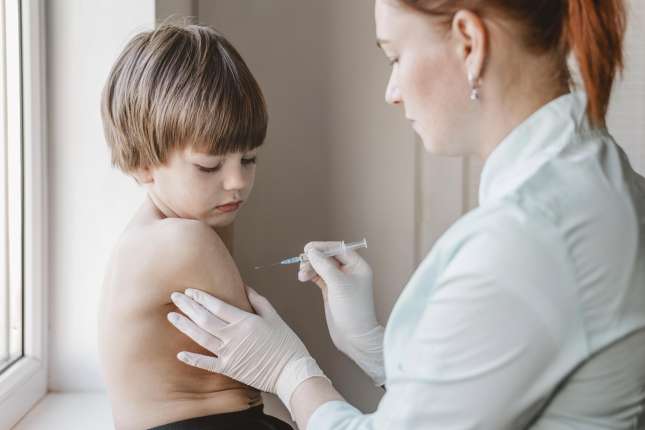 doctor-with-child-getting-vaccine