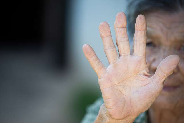 close-up-picture-old-woman-s-hand-showing-anti-symbol