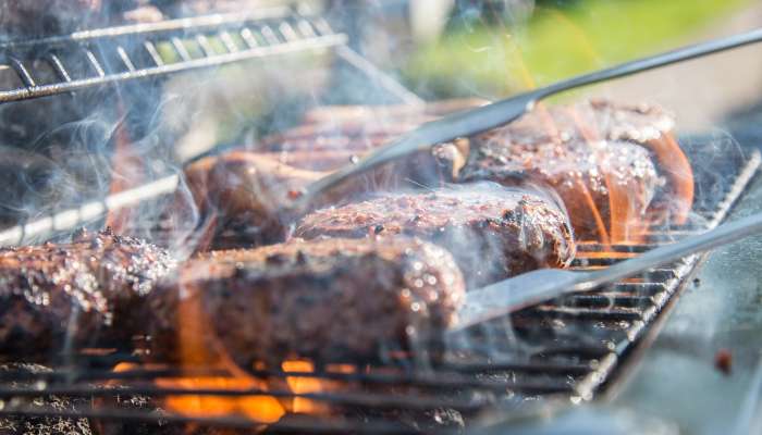 close-photography-of-grilled-meat-on-griddle-1105325