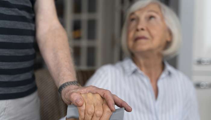 elderly-woman-looking-her-caregiver