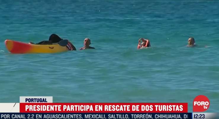 Portugalski predsednik de Sousa je reševati ženski, ki se jima je na morju prevrnil kajak (VIDEO)