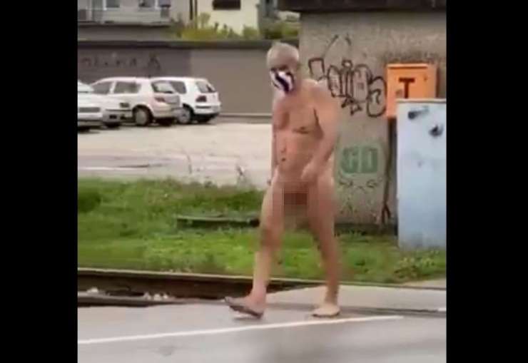 Neverjeten prizor v Ljubljani: popolnoma gol možak z zaščitno masko jo je mahal po cesti (VIDEO)