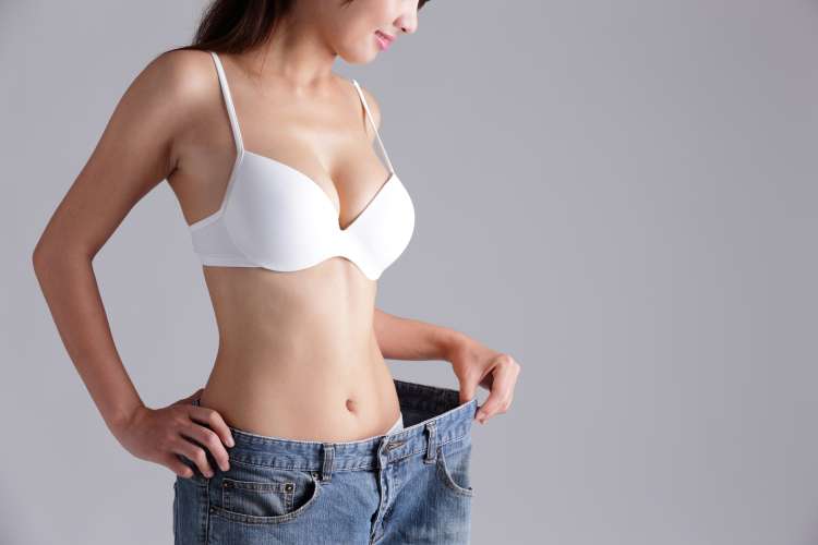 Woman shows weight loss.jpg