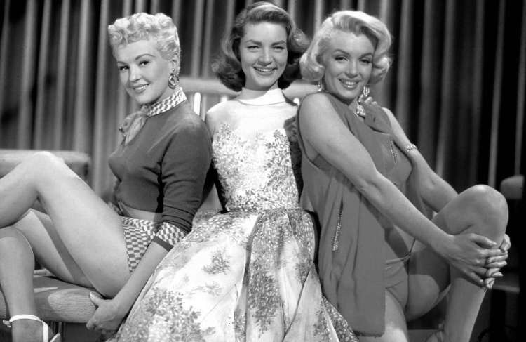 Betty Grable, Lauren Bacall, Marilyn Monroe in How to Marry a Millionaire.jpg
