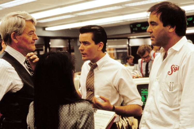 Wall Street (1987) Oliverja Stonea s Charlijem Sheenom.