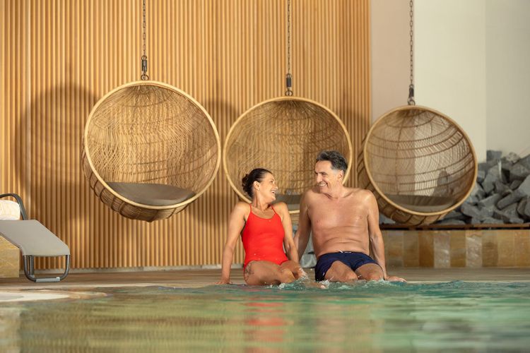 T3_HLP_indoor_pool_senior_couple_05_TheOther_2025_lowres.jpg