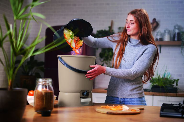 Emptying Organko Daily into Bokashi Organko Essential + base composter.jpg
