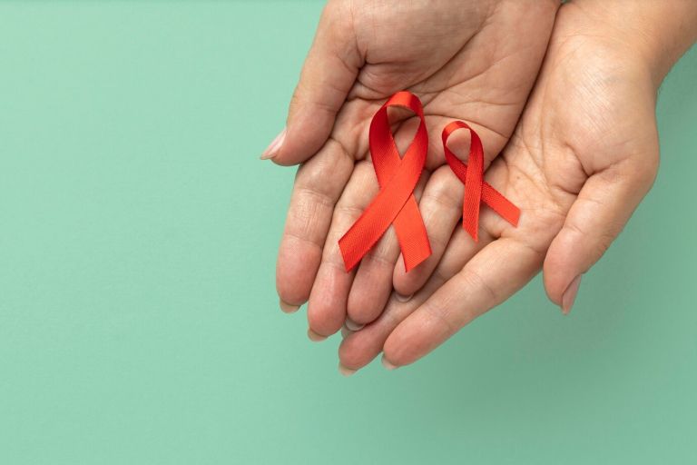 person-holding-world-aids-day-ribbon_23-2149094813.jpg