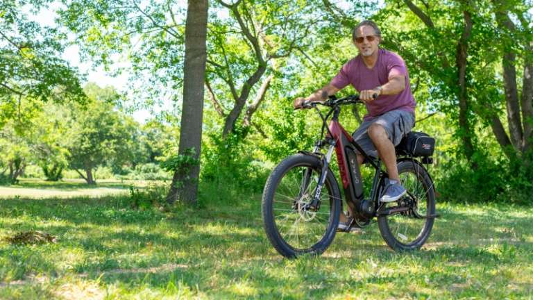 1720535505_free-photo-of-photograph-of-a-man-riding-an-electric-bicycle.jpeg