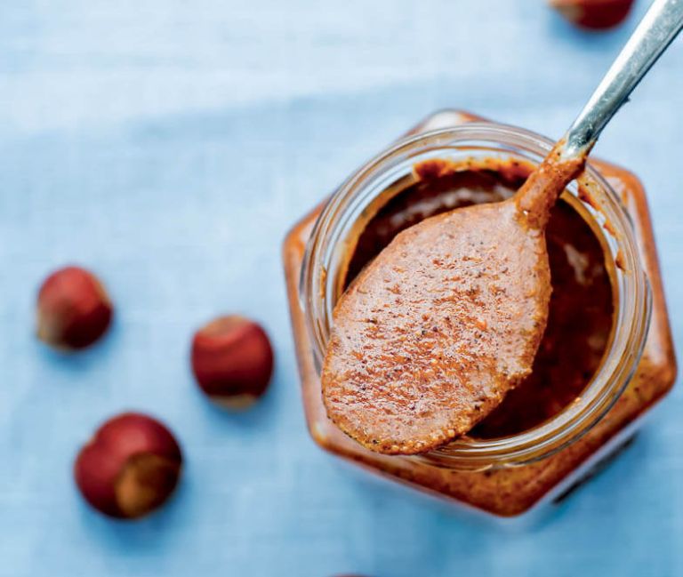 Praline,In,A,Jar,On,A,Blue,Background.,Tinting.,Selective