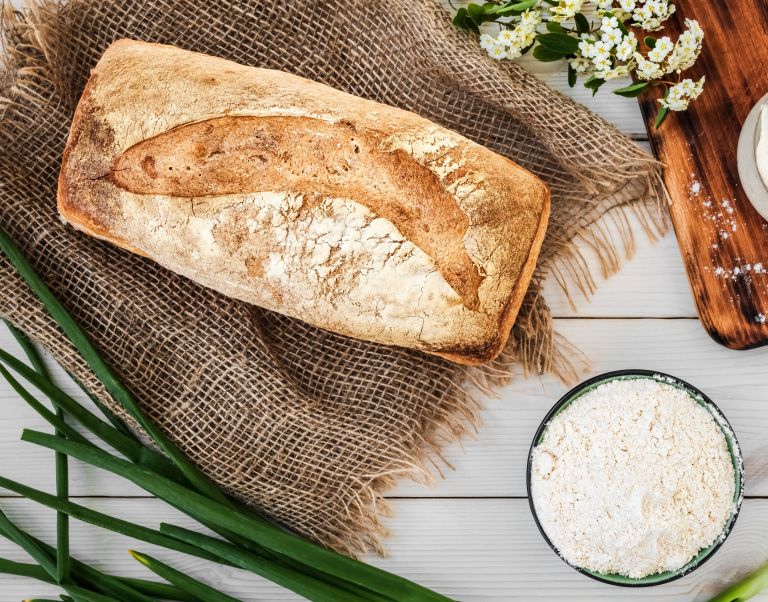 sourdough-preparation-bread-flour-freshly-baked-bread-white-wooden-table.jpg