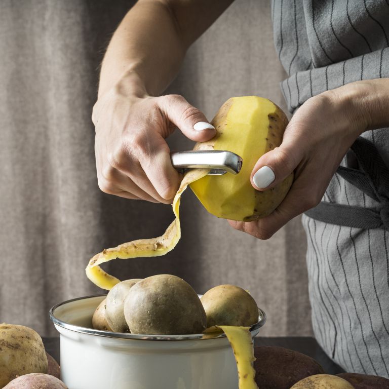 woman-peeling-raw-potato.jpg